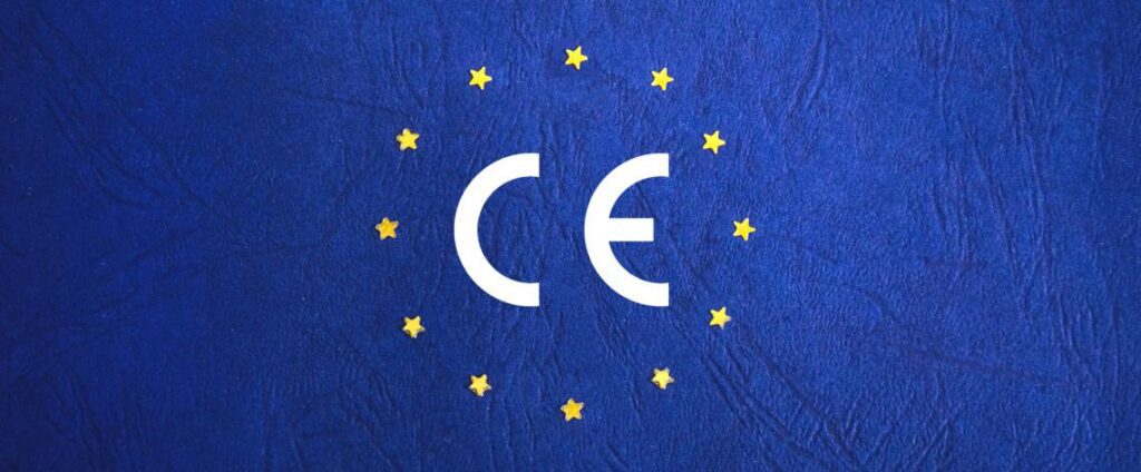 The white CE certification logo surrounded by a circle of yellow stars against a textured blue EU flag background.