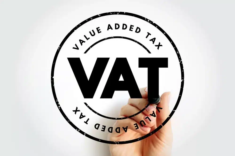 UK De Minimis £135: Duty-Free but VAT Applies 3 A hand drawing a black circular stamp with the bold text "VAT" and "VALUE ADDED TAX" on a white background, representing UK VAT compliance.